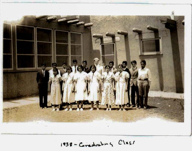 The 1938 graduating class of Taos Day School captured in an old black and white photo.