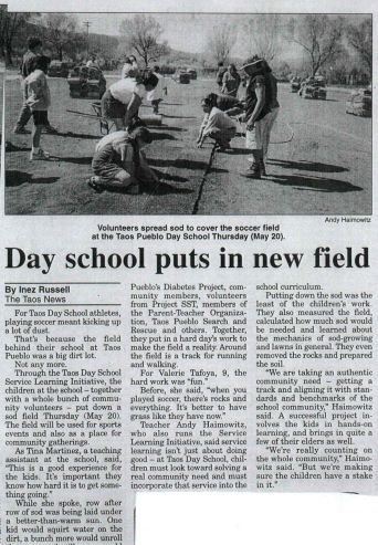 newspaper clipping entitled Day School Puts in New Field and photo with caption, Volunteers spread sod to cover the soccer field at the Taos Pueblo Day School