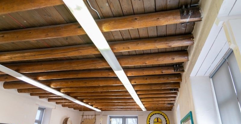 wood supporting beams on ceiling of school