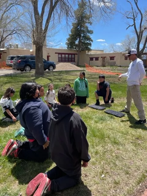Dr. Dorame Instructing Students on Horticulture at Taos Day School.