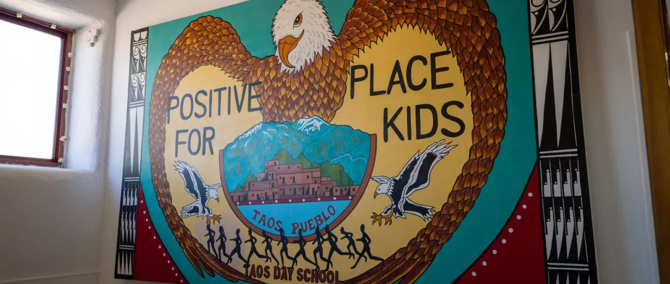 Taos Day School Colorful Eagle Mural with Positive Place For Kids Written on It.