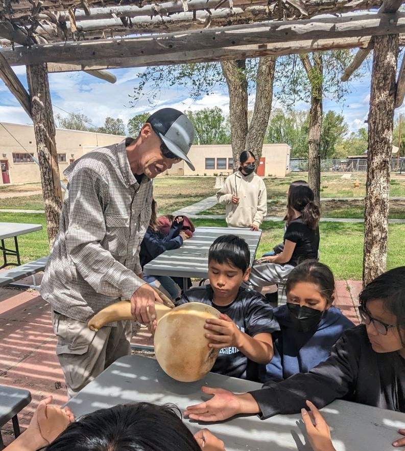 Students outside learning about planting