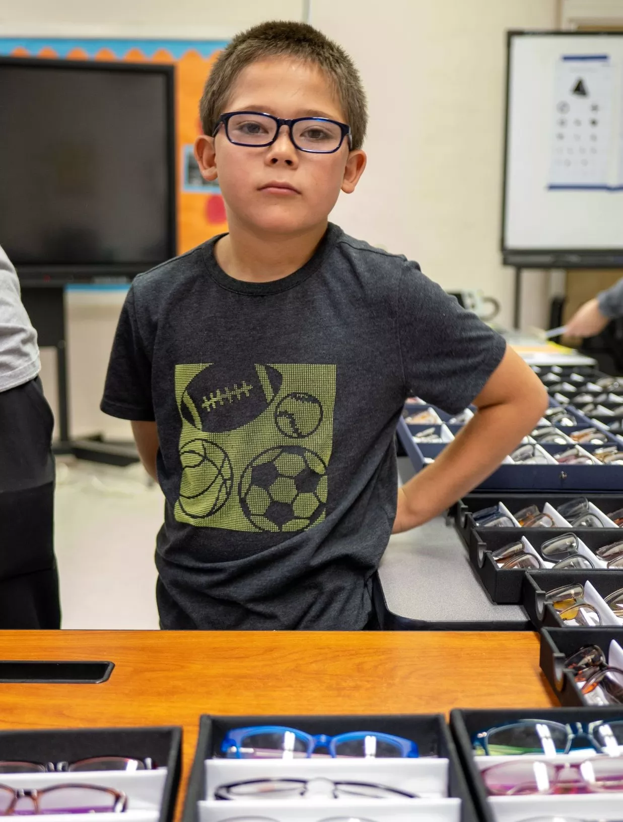 Taos Day School Boy Student Showing off His New Prescription Glasses.