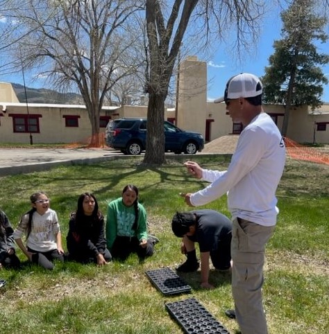 Dr. Dorame Instructing Students on Horticulture at Taos Day School.