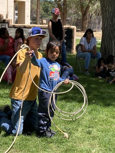 Student learning roping.