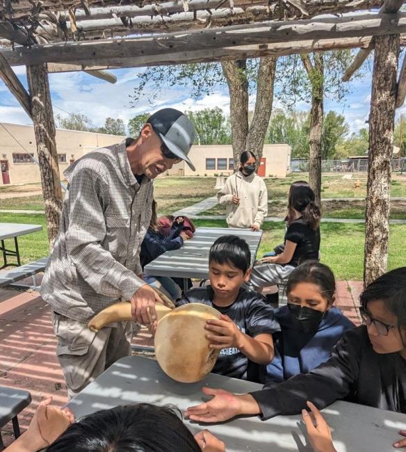 Students outside learning about planting